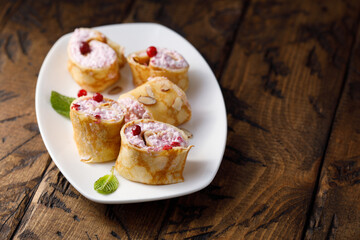 Pancakes with berries and cream cheese