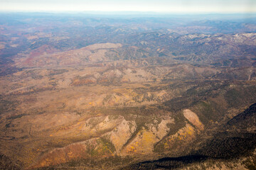 Aerial view. Golden autumn in Primorsky Krai. The Sikhote-Alin mountain range from above.