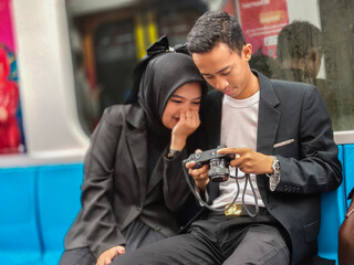 Asian young couple take a pre-wedding shoot at Jakarta MRT station in Jakarta, Indonesia