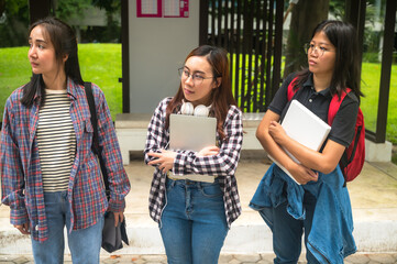 Cheerful young female Asian college students enjoy lifestyle in campus