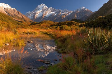 Obraz premium Mountain reflection in a tranquil alpine pool at dawn
