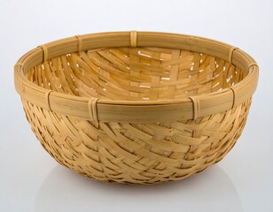 A light beige, round, woven bamboo basket is presented against a bright white background.