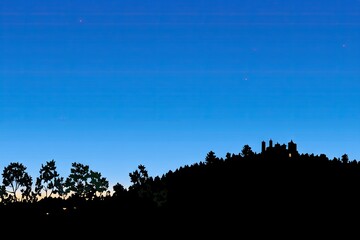 Silhouetted hilltop at twilight