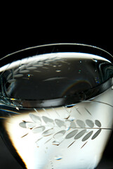 Crystal glassware with high contrast light. Night. Cocktail party. Poster. Close up. Soft focus