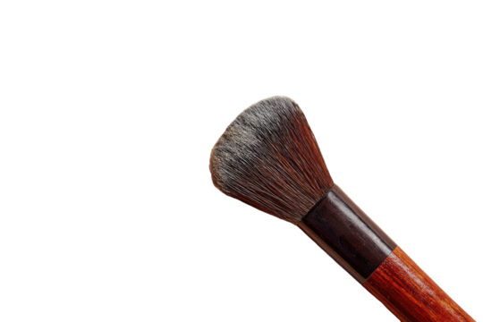 Close-up of a makeup brush.  A small, tapered brush head with a dark-brown, natural-looking bristle cluster.  The wooden handle is a rich, reddish-brown.  Isolated on a black background