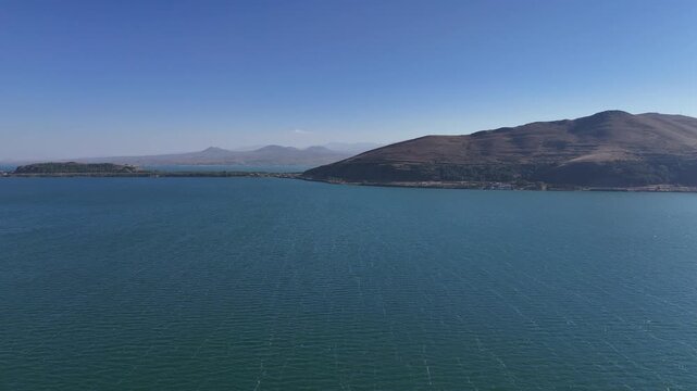 Aerial View of Lake Sevan Armenia &ndash; Mountains, Church, Waves, and Peninsula