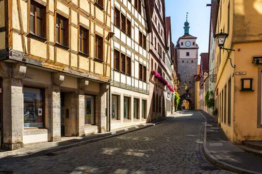 Medieval street with traditional timber frame buildings in Rothenburg ob der Tauber