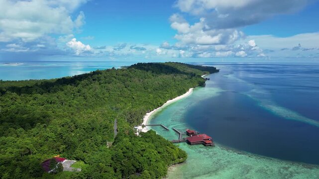 Maratua, Indonesia: Aerial drone footage of a resort in famous Maratua lagoon and island in the Derawan Archipelago in Borneo Indonesia. Shot with orbit motion