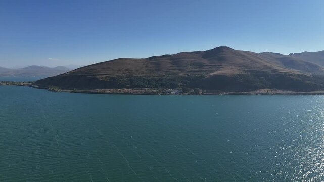 Aerial View of Lake Sevan Armenia &ndash; Mountains, Church, Waves, and Peninsula