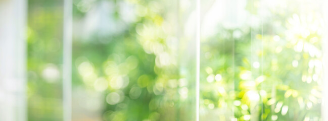 Selective focus window glass building with blur green gaeden.environmental concepts