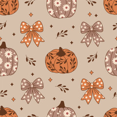 seamless pattern with pumpkins and bows