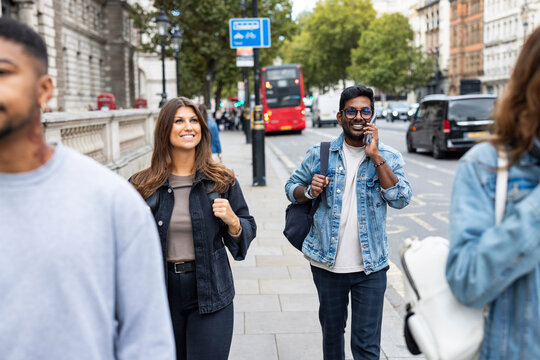 Commuters walking in London city during busy rush hour