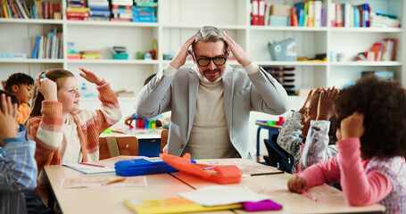 Learning, dance and kids with teacher in classroom for education song, support and anatomy lesson. Singing, child development and game with students and man in school for knowledge and teaching