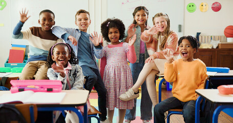 Education, portrait and children with wave in classroom together for learning, growth or development. Friends, smile and happy student kids in back to school class for excited, knowledge or academics