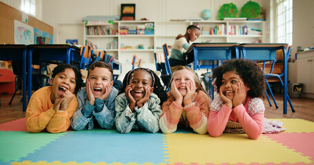 Portrait, group and children in classroom, happy and bonding in elementary, growth and development. School, kids and smile for knowledge, learning and education for students, academic or excited