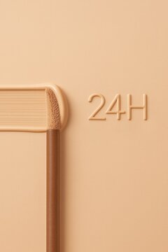 Concealer brush with foundation stroke and 24H long lasting makeup concept
