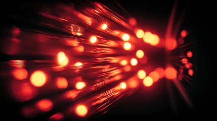 Glowing fiber optic cables with blurred bokeh lights create an abstract digital scene.