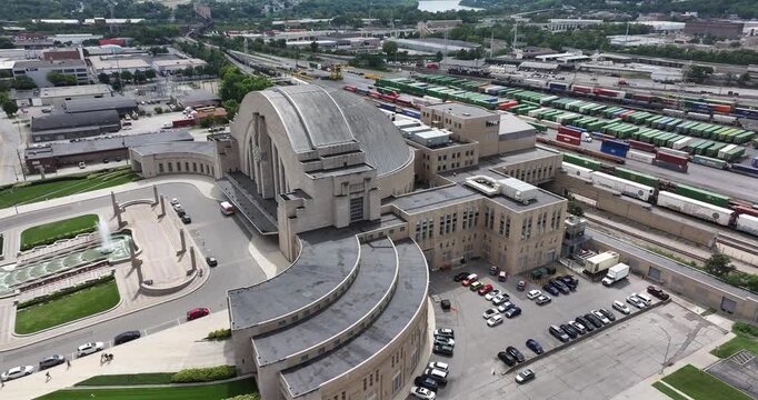 Cincinnati, United States - 22 August 2025: Aerial view of Cincinnati Union Terminal, a Beaux-Arts style train station, surrounded by train tracks and parking lots.