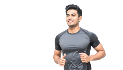 A man in athletic clothing smiles while jogging, showcasing fitness and energy.