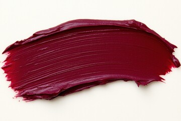 Lipstick smear closeup showing makeup texture and rich red color detail, glossy cosmetic product for beauty skincare and grooming design