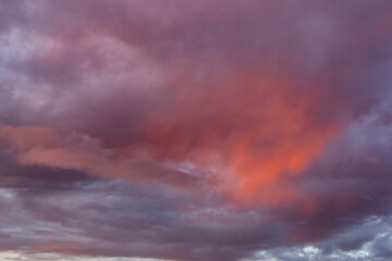 Red and purple clouds at sunrise in dramatic sky