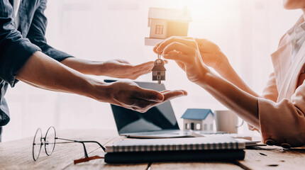 Real estate broker agent presenting and consult to customer to decision making sign insurance form...