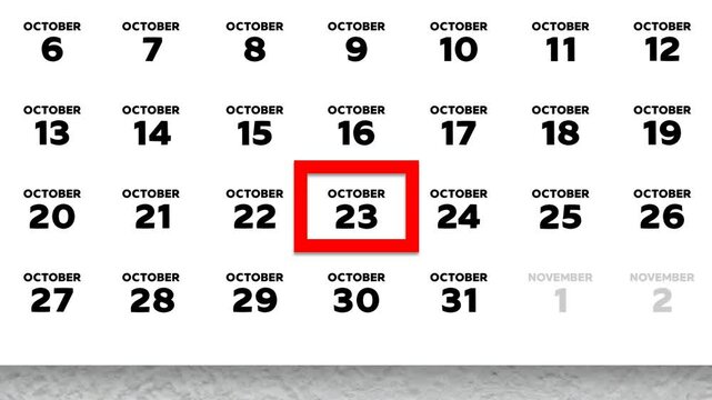 The date October 23rd marked with a red cursor on the wall calendar 2025