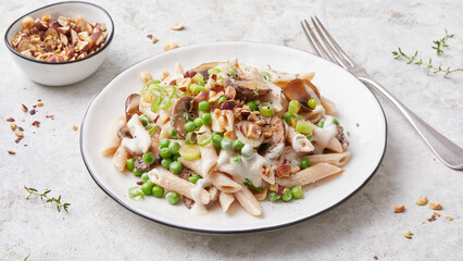Pasta with peas and hazelnuts