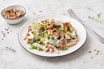 Pasta with peas and hazelnuts