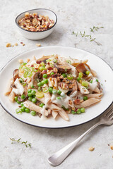 Pasta with peas and hazelnuts