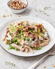 Pasta with peas and hazelnuts