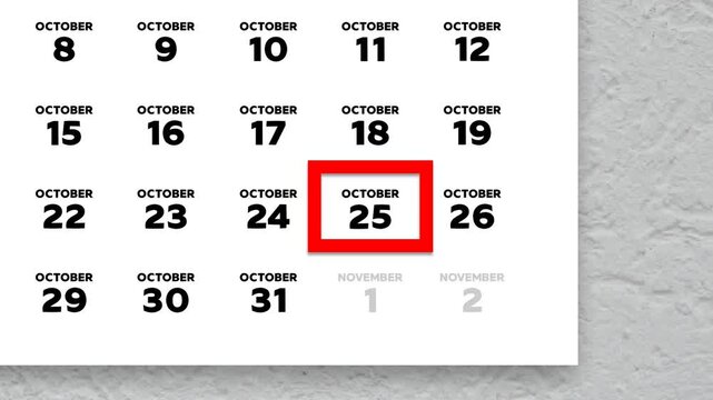 The date October 25th marked with a red cursor on the wall calendar 2025