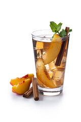 Refreshing peach iced tea in glass with ice cubes and cinnamon isolated on white background	