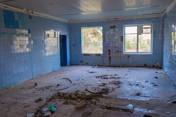 Abandoned Room with Blue Walls and Debris - the abandoned pioneer camp of the USSR