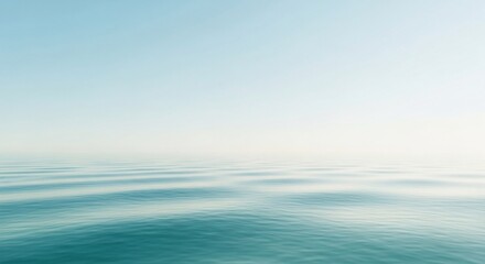 Obraz premium Calm ocean view with blue sky and gentle waves peaceful scenery.