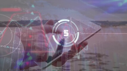 Countdown and data processing over mid section of caucasian man using digital tablet at the beach - Powered by Adobe