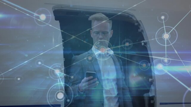 Animation of data processing over caucasian businessman using smartphone