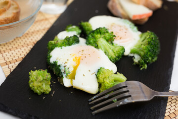 breakfast of crumpled eggs with broccoli