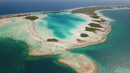 French Polynesia, Rangiroa island: Breathtaking aerial view of Rangiroa largest atoll in the Tuamotus. Wild nature travel landscape. Drone flight
