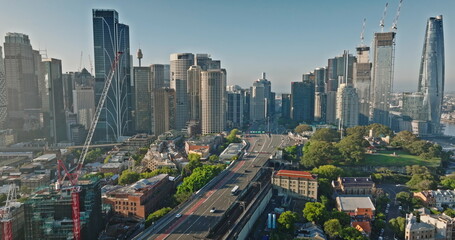 Australia, Sydney: Aerial view Sydney's urban landscape with skyscrapers, bridge road cars, highway...