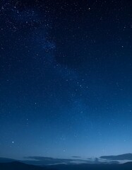 Naklejka premium Starry night sky over mountains