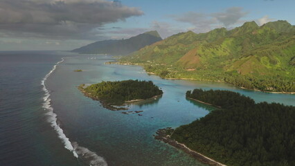 Aerial drone stunning beauty of Moorea tropical island in French Polynesia, green mountains, turquoise lagoon coral reef. Popular travel destination, remote wild paradise, exotic summer travel