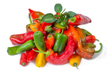 Colorful assortment of peppers on white background