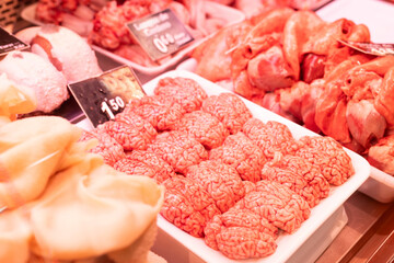 Raw sheep brains on counter of butcher shop