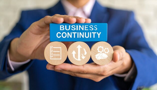 Business Continuity Concept – Person Holding Wooden Blocks with Planning, Process, and Operations Icons