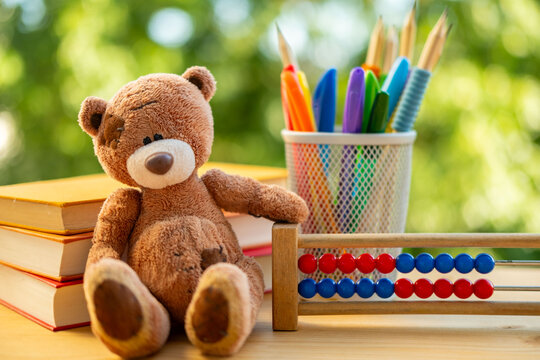 school supplies, teddy bear toy, back-to-school concepts or creative learning, School or art workspace, drawing and writing Learning tools, hands-on education, student writing supplies, energy nature