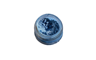 Deep blue eyeshadow in a clear jar