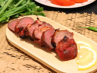 Honey roasted red pork, tender and juicy with a glossy sweet glaze, a delicious Asian-style dish served as a savory and aromatic delicacy.