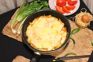 Double cheese pineapple pizza served in a hot pan, rich, cheesy, and delicious with a tropical twist.