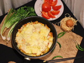 Double cheese pineapple pizza served in a hot pan, rich, cheesy, and delicious with a tropical twist.